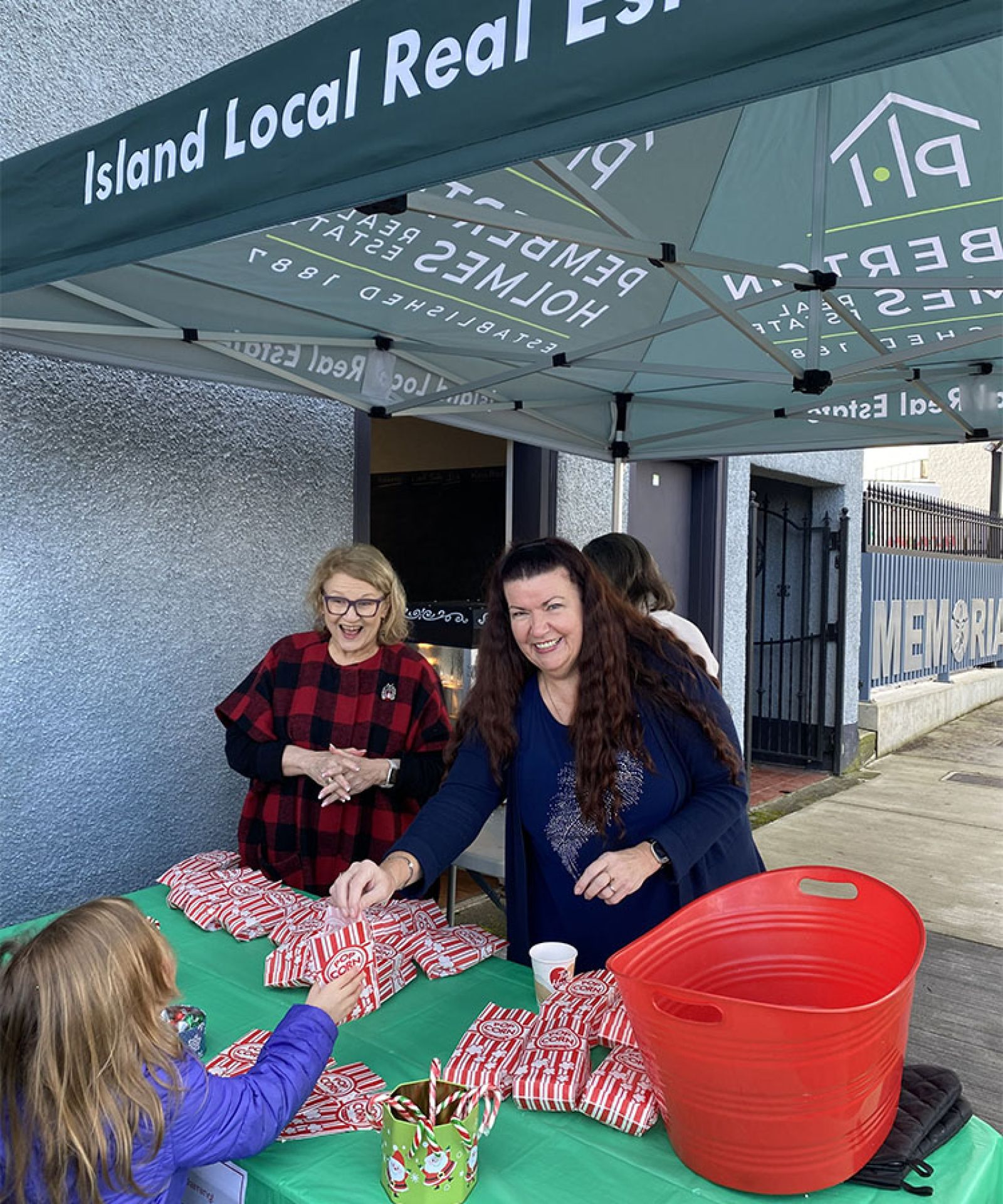 Parksville Downtown volunteer helping at a booth in downtown Parksville Volunteer for Parksville Downtown
